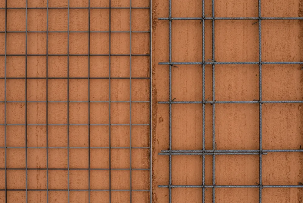 Side-by-side comparison of welded wire mesh and #4 rebar reinforcement options for North Texas concrete driveways